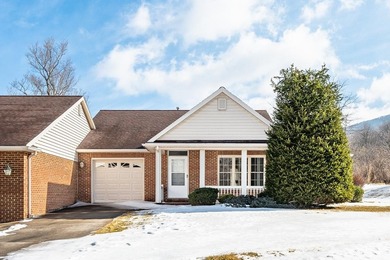 One level living. End unit townhouse offering inviting front