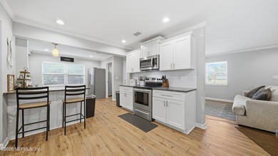 Welcome to this beautifully renovated 4-bedroom, 3-bathroom - photo 9