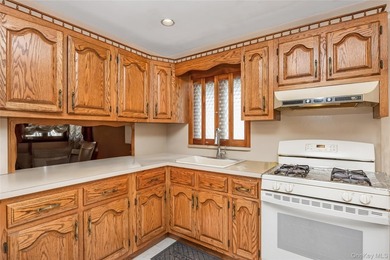 Welcome to this charming detached corner ranch nestled in the - photo 12