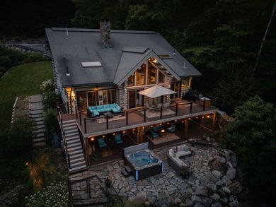 Experience exceptional lakeside living in this custom-built log - photo 3