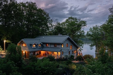 Experience exceptional lakeside living in this custom-built log - photo 4