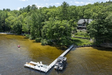 Experience exceptional lakeside living in this custom-built log - photo 5