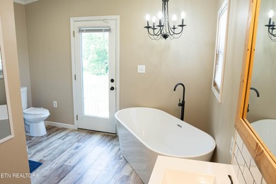 Half an acre. A creek. A master bath that belongs in a magazine - photo 14