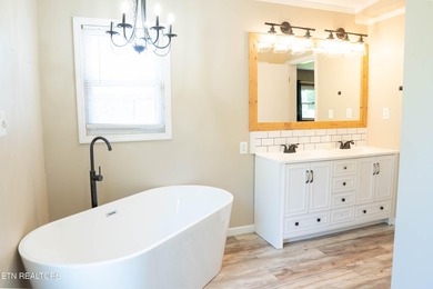 Half an acre. A creek. A master bath that belongs in a magazine - photo 16