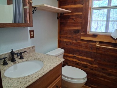 This 884 sq ft log cabin sits in Sardis Acres overlooking the - photo 10