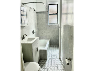 Exceptional opportunity to own a fully renovated 6-family brick - photo 5