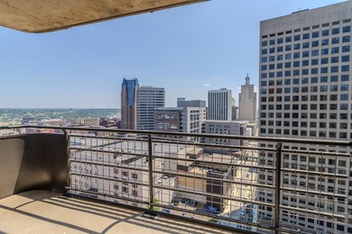 Soaring above the city on the 23rd floor, this refined 2-bedroom - photo 1
