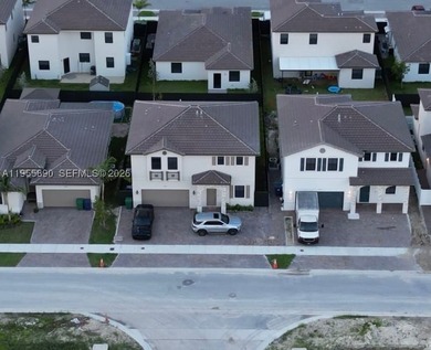 The first level of this two-story home is host to the communal - photo 3