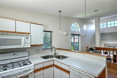 This well-maintained townhouse-style condominium is located in - photo 13