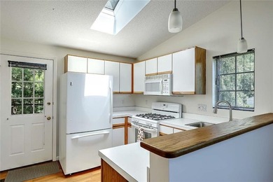 This well-maintained townhouse-style condominium is located in - photo 14