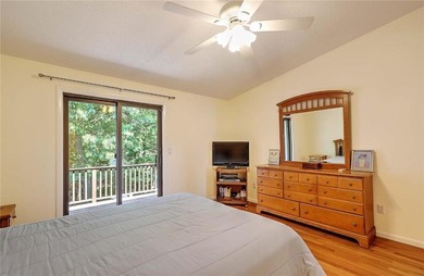This well-maintained townhouse-style condominium is located in - photo 17