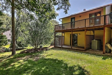 This well-maintained townhouse-style condominium is located in - photo 29