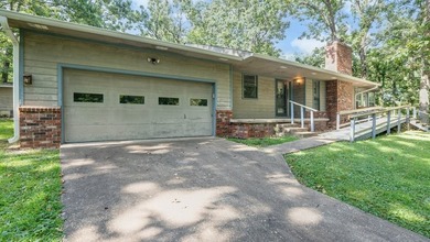 Come home to this charming house nestled in the woods on over an - photo 10