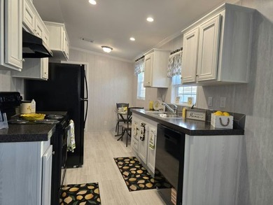 Own your own home in a quiet, well-maintained neighborhood! This - photo 2