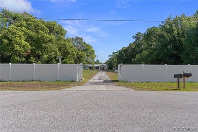 Nestled on approximately 1.6 acres in Homosassa, this charming - photo 2