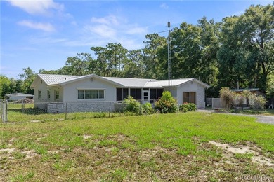 Nestled on approximately 1.6 acres in Homosassa, this charming - photo 3