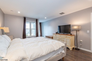 Experience elevated lakefront living in this stylish townhouse - photo 12