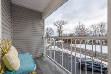Experience elevated lakefront living in this stylish townhouse - photo 14