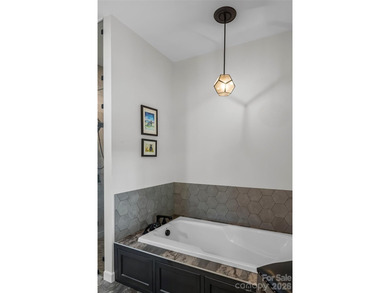 Experience ultimate luxury in this custom-built ranch home - photo 22