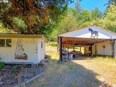 A gated entrance reveals this stunning 24-acre secluded parcel - photo 4