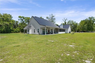 Welcome home to this stunning custom-built farmhouse homestead - photo 3