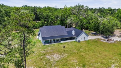 Welcome home to this stunning custom-built farmhouse homestead - photo 5