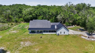 Welcome home to this stunning custom-built farmhouse homestead - photo 6