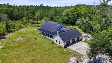 Welcome home to this stunning custom-built farmhouse homestead - photo 8