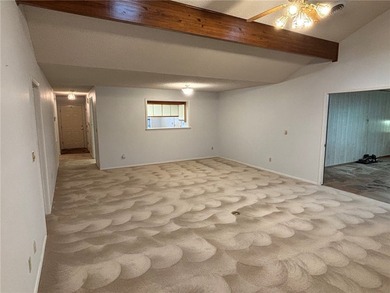 One of the largest condos in White Oak Station features a beamed - photo 3