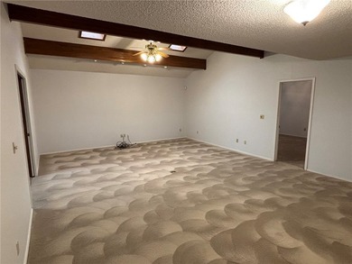 One of the largest condos in White Oak Station features a beamed - photo 4