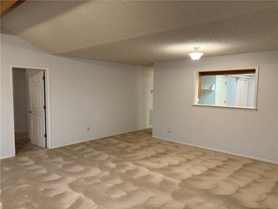 One of the largest condos in White Oak Station features a beamed - photo 6