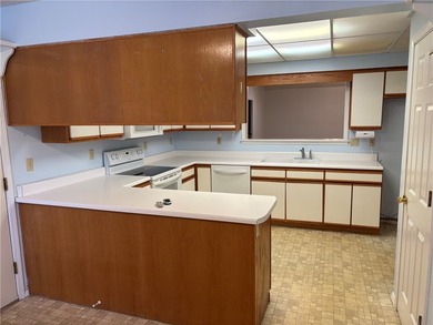 One of the largest condos in White Oak Station features a beamed - photo 8