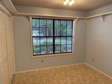 One of the largest condos in White Oak Station features a beamed - photo 9