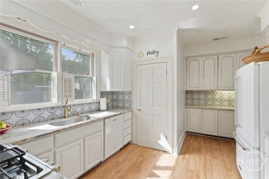 Charming Midtown brick ranch on a corner lot featuring a covered - photo 9