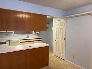 One of the largest condos in White Oak Station features a beamed - photo 10