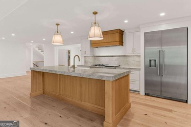 This incredible home is masterfully reimagined with intentional - photo 25