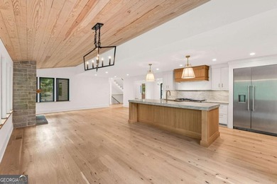 This incredible home is masterfully reimagined with intentional - photo 31