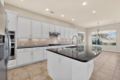 Ready to create your dream golf course retreat? This stucco and