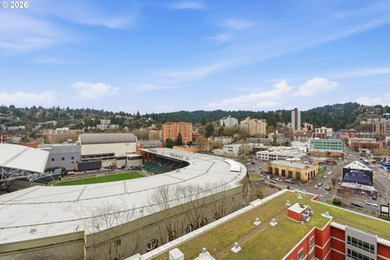 Enjoy west-facing city, sunset, and stadium views at this modern