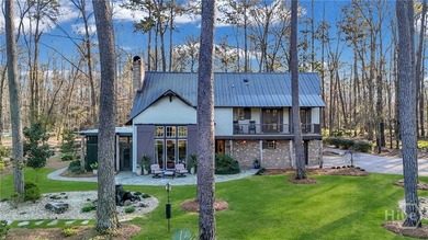 This rare 2-bedroom, 2-bath Lowcountry cottage is nestled on - photo 1