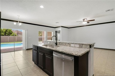 WOW!! Gorgeous custom pool home featuring 4 spacious bedrooms, 3 - photo 7