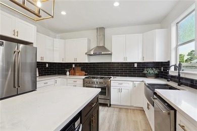 Thoughtfully renovated in 2021, this Canal Blvd residence blends - photo 11
