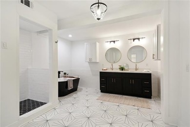 Thoughtfully renovated in 2021, this Canal Blvd residence blends - photo 18