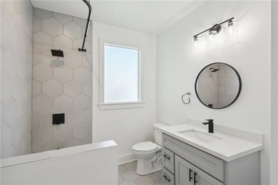 Thoughtfully renovated in 2021, this Canal Blvd residence blends - photo 25