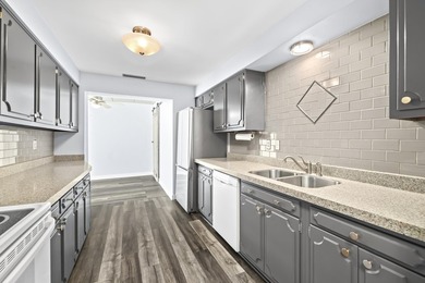 Lake Michigan views and effortless Bay View living await in this - photo 8