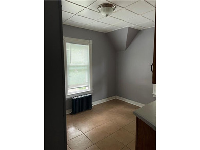 Welcome to this well-maintained 3 family home + 2 car garage - photo 13