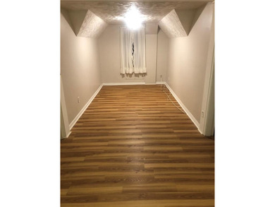 Welcome to this well-maintained 3 family home + 2 car garage - photo 16