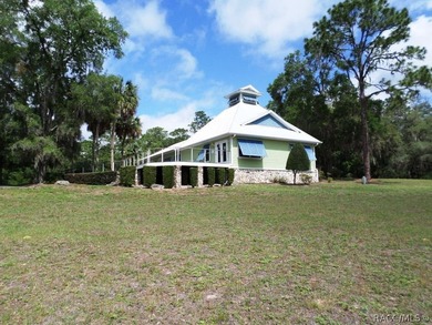 Situated centrally within the Rainbow Springs Community, this - photo 2