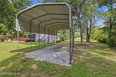 Move in ready on one acre of private land! Country feel, city - photo 10