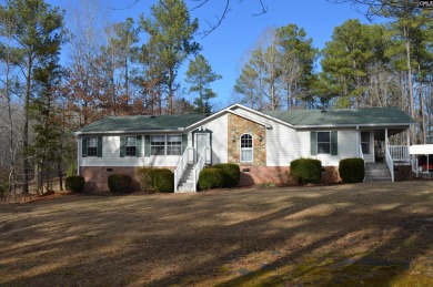 Updated and show-worthy!  This 3 bedroom, 2 bath home sits on a - Lake Home For Sale in Ridgeway, South Carolina